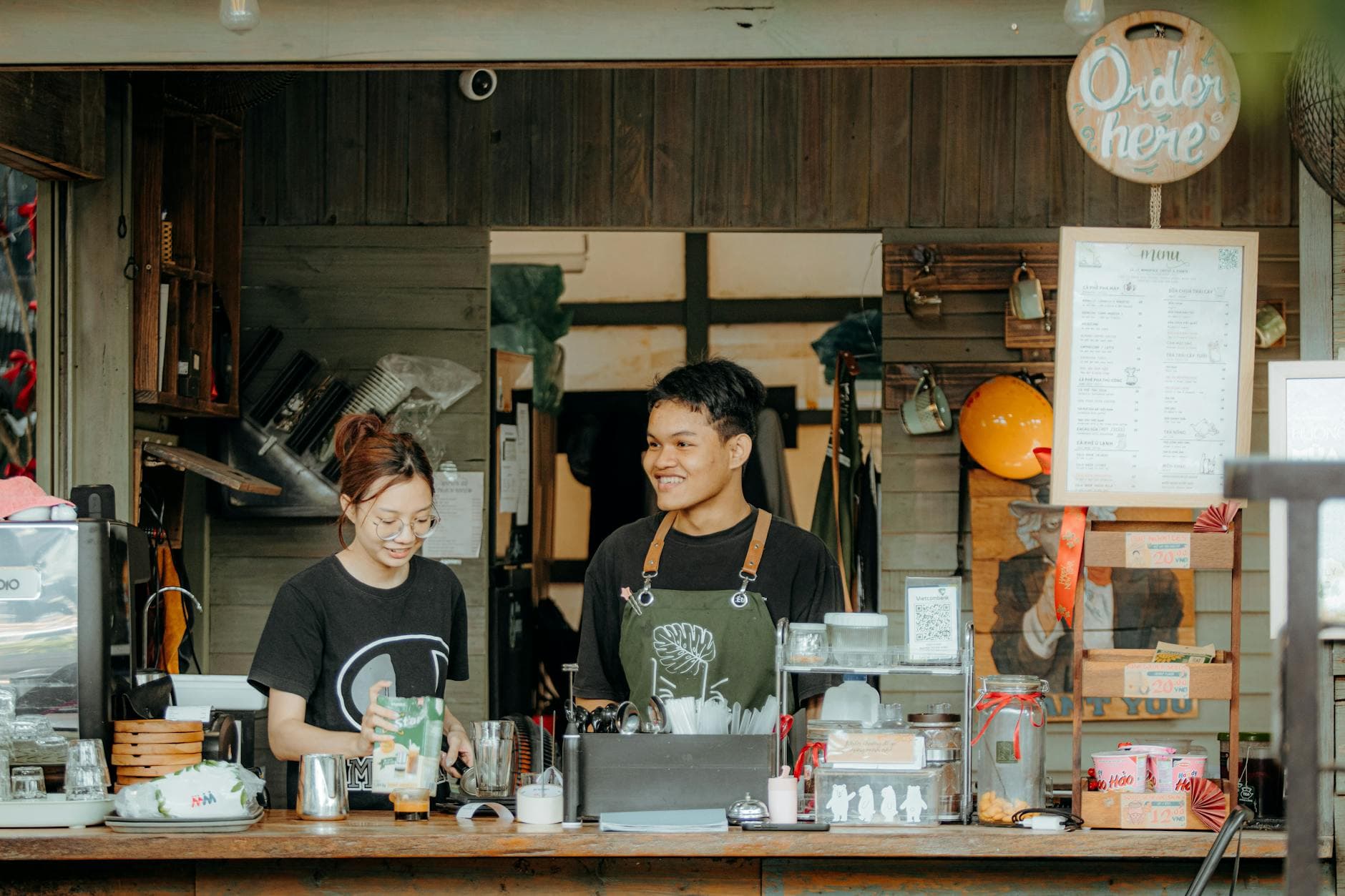 Cafe team working together behind the counter